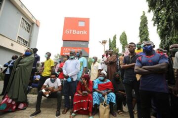 Frustrated customers outside closed GTBank branch during system outage